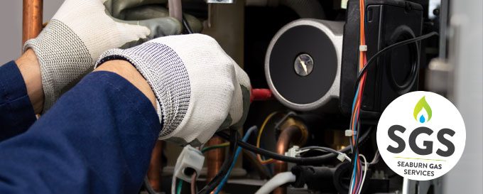 Seaburn Gas engineer servicing a boiler